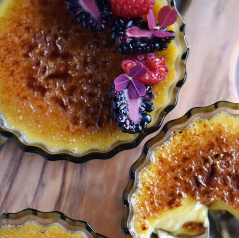 Skyr Brulee Tarts: Mini sweet crust pastries filled with skyr and topped with caramelized sugar and fresh berries.